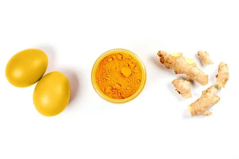 Easter eggs colored naturally with ingredients - turmeric and ginger Stock Photos