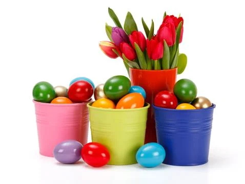 Easter eggs in colored tin buckets Stock Photos