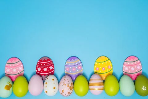 Easter Eggs. Colorful Easter eggs on blue background with copy space. Easter  Stock Photos