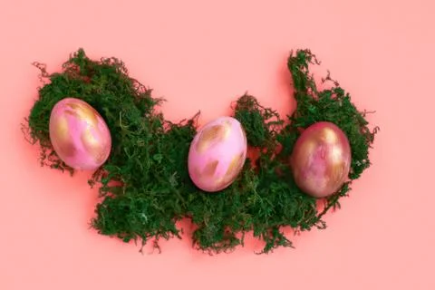 Easter eggs on coral background. Stock Photos