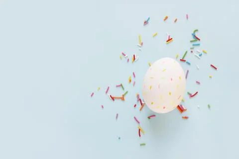 Easter eggs creative flat lay on blue background. Minimal concept. Stock Photos