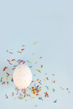 Easter eggs creative flat lay on blue background. Minimal concept. Stock Photos