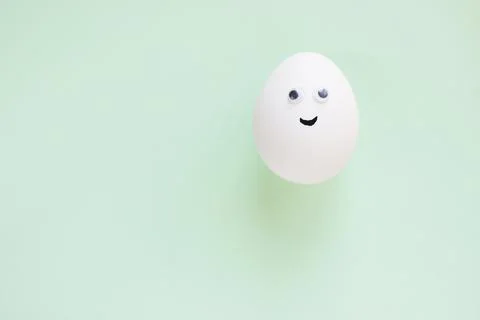 Easter eggs creative flat lay on blue background. Minimal concept. Stock Photos