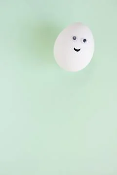 Easter eggs creative flat lay on blue background. Minimal concept. Stock Photos