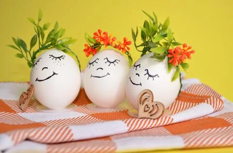 Easter eggs with cute faces on a napkin. Spring. Easter. Stock Photos