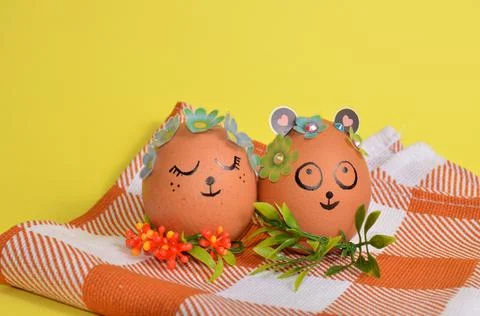 Easter eggs with cute faces on a napkin. Spring. Easter. Stock Photos