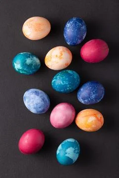 Easter eggs on dark stone background, top view 写真素材