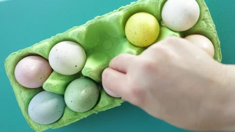 Easter eggs decorated hand puts in a box Stock Footage 172148746