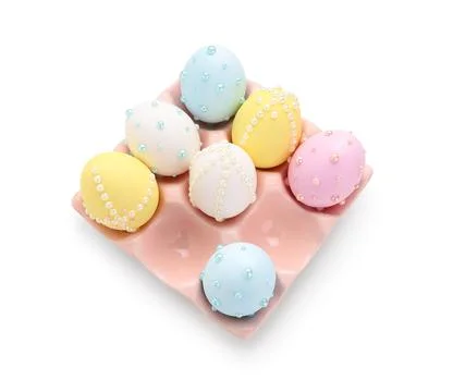Easter eggs decorated with pearls in ceramic holder isolated on white backgro Stock Photos