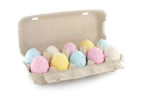 Easter eggs decorated with pearls in holder isolated on white background Stock Photos