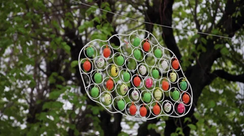Easter eggs decorations in the trees, symbol, metal frame, handy craft, outdoors Stock Footage 37123698