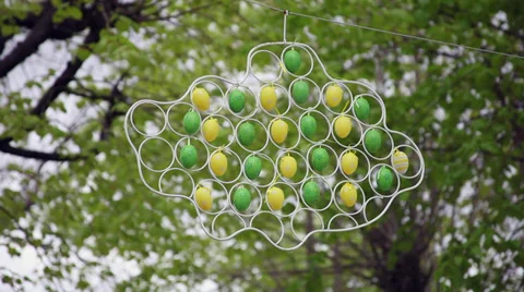 Easter eggs decorations in the trees, symbol, metal frame, handy craft, outdoors Stock Footage 37123733