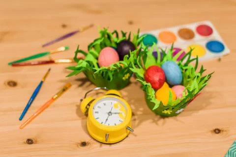 Easter eggs of different bright colors with  brushes and multicolor paints Stock Photos