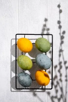 Easter eggs drying on a cooling rack after being naturally dyed with hibisc.. Stock Photos