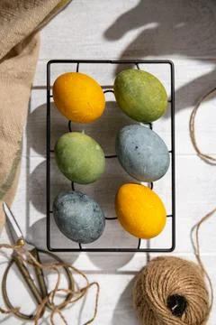 Easter eggs drying on a cooling rack after being naturally dyed with hibiscus Foto stock