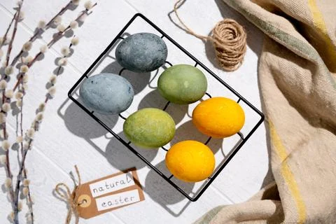 Easter eggs drying on a cooling rack after being naturally dyed with hibisc.. 写真素材