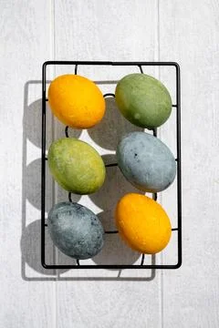 Easter eggs drying on a cooling rack after being naturally dyed with hibisc.. Stock Photos