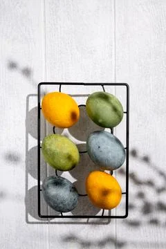 Easter eggs drying on a cooling rack after being naturally dyed with hibisc.. Stock Photos