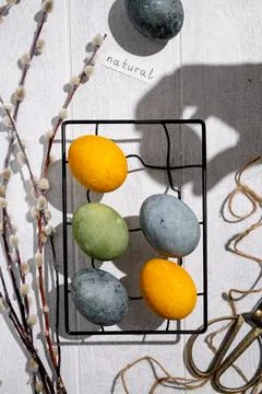 Easter eggs drying on a cooling rack after being naturally dyed with hibisc.. Stock Photos