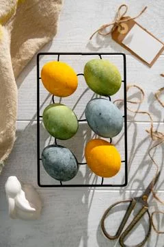 Easter eggs drying on a cooling rack after being naturally dyed with hibisc.. Stock Photos