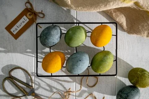 Easter eggs drying on a cooling rack after being naturally dyed with hibisc.. Stock Photos