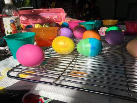 Easter Eggs Dyed and Drying on a Cooling Rack Stock Photos