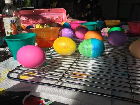 Easter Eggs Dyed and Drying on a Cooling Rack Stock Photos