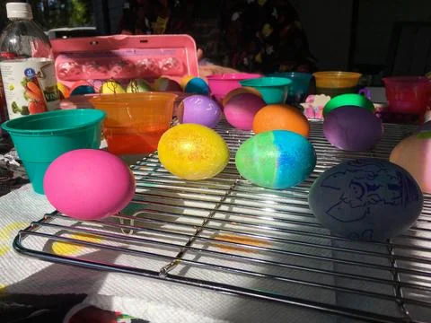 Easter Eggs Dyed and Drying on a Cooling Rack Stock Photos