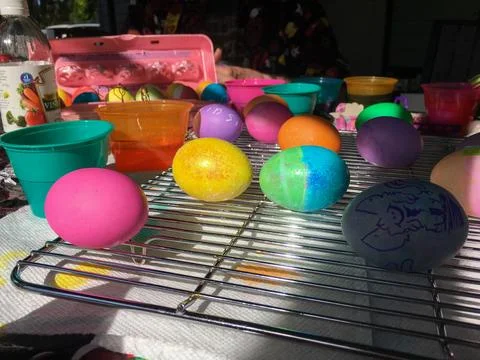 Easter Eggs Dyed and Drying on a Cooling Rack Stock Photos