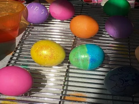 Easter Eggs Dyed and Drying on a Cooling Rack Stock Photos