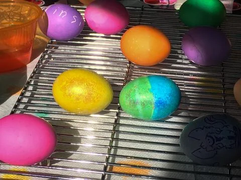 Easter Eggs Dyed and Drying on a Cooling Rack Stock Photos