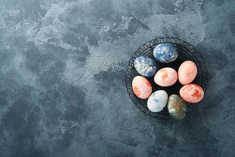 Easter eggs. Dyed Easter eggs with marble stone effect ref and blue color in  Stock Photos
