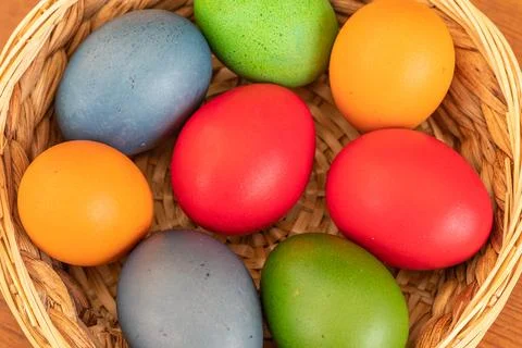 Easter eggs, dyed hen eggs in a wicker basket Stock Photos