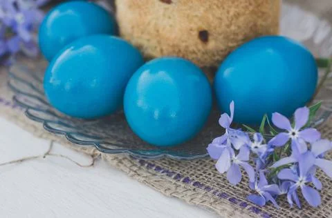 Easter eggs with Easter and flowers close-up. Stock Photos