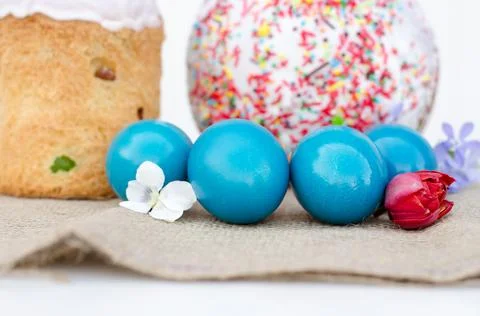 Easter eggs with Easter and flowers close-up. Stock Photos