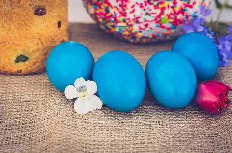 Easter eggs with Easter and flowers close-up. Stock Photos