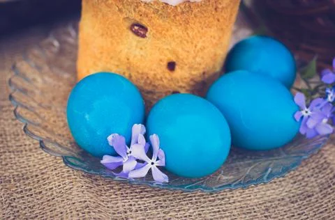 Easter eggs with Easter and flowers close-up. Stock Photos