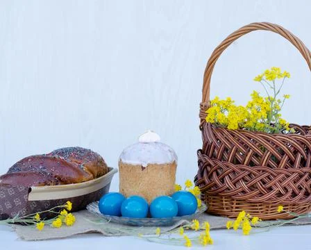Easter eggs with Easter, flowers and a wicker basket Stock Photos