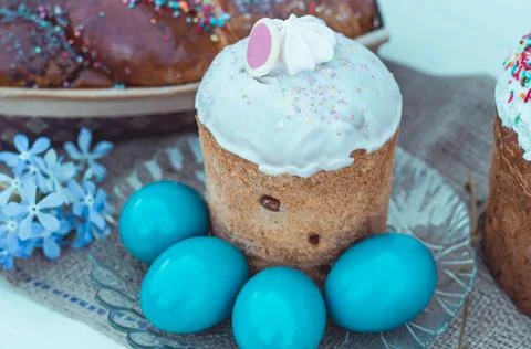 Easter eggs with Easter, flowers and a wicker basket Stock Photos