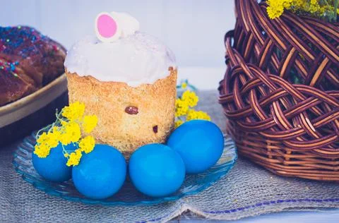 Easter eggs with Easter, flowers and a wicker basket Stock Photos