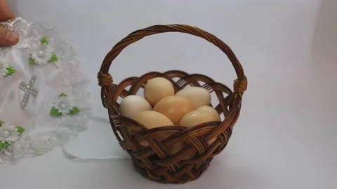 Easter eggs. Eggs on a white background. Chicken eggs in a basket Stock Footage 237339168