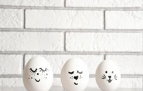 Easter eggs emoticons on a light background Stock Photos
