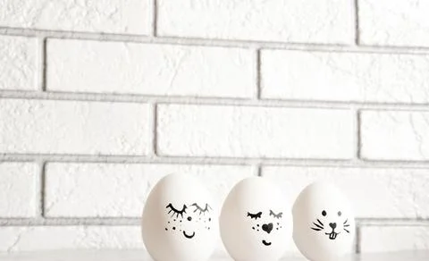 Easter eggs emoticons on a light background Stock Photos