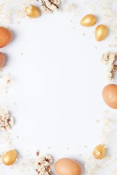 Easter eggs with flowers on white background. Flat lay, copy space. beautiful Stock Photos