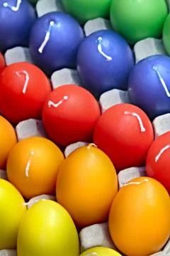 Easter eggs in the form of candles in standard packing. Stock Photos