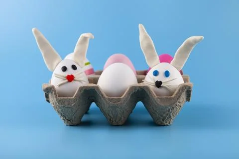 Easter eggs in the form of a rabbit in a cardboard box Stock Photos