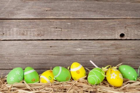 Easter eggs in front of wooden wall Stock Photos