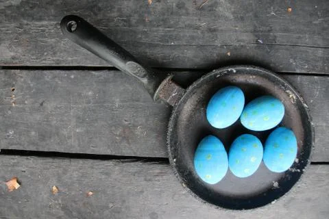 Easter eggs in a frying pan Stock Photos