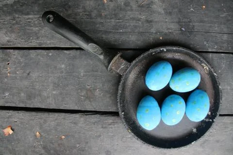 Easter eggs in a frying pan Stock Photos