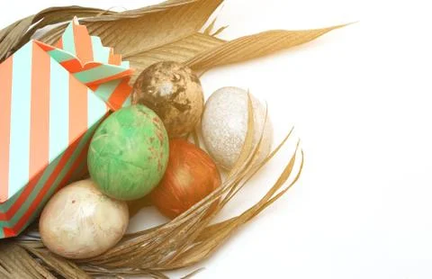 Easter eggs with gift box on white background Stock Photos